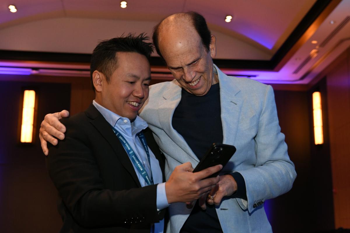 Mike Milken and Smith Sirisakorn